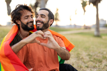 Naklejka premium Happy couple with a pride flag. LGBT community..