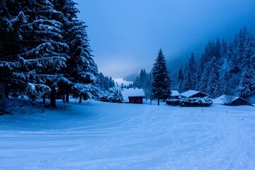 Beautiful snowy village in Switzerland in the evening