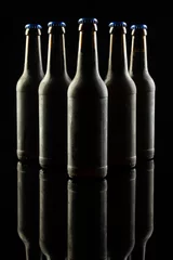 Gordijnen Vertical image of five dark glass bottles of lager beer with blue caps on black, with copy space © vectorfusionart