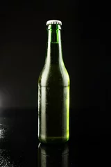 Gordijnen Image of green glass beer bottle with white crown cap, with copy space on black background © vectorfusionart