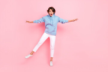 Full body photo of astonished terrified lady stylish clothes stand one foot look empty space high...