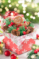 Fototapeta na wymiar Christmas Decorations with Gingerbread cookie man and Gift Box. Traditional holiday symbol. Christmas card.