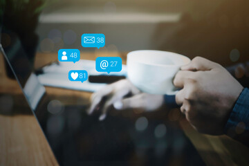 Person hand using a laptop computer with social media marketing concept.