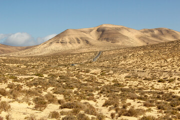 Road in vulcanic landscape of Fuerteventura Island, Canary Island, Spain, Europe.