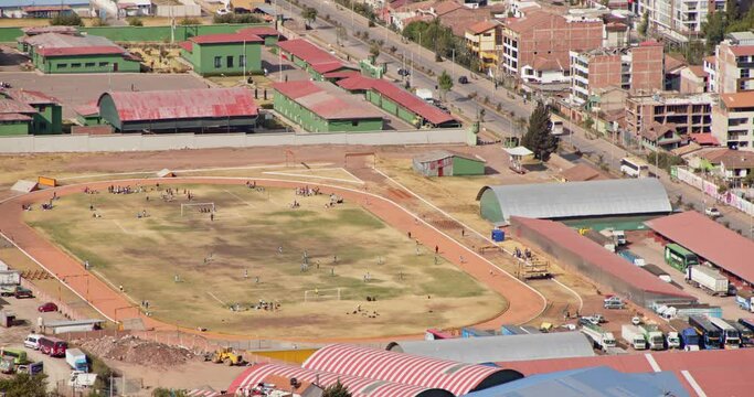 People playing Football on field aerial view - 4k Timelapse.