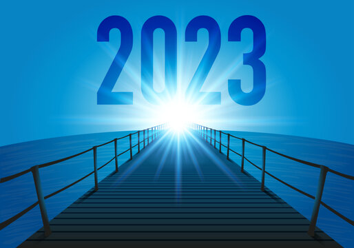L’année 2023 avec l’objectif à atteindre pour l’avenir d’une entreprise, avec le symbole d’un ponton traversant l’océan en direction du soleil qui brille à l’horizon.