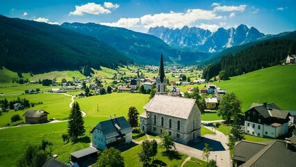 Aerial shot of St Magdalena church in Val di Funes valley, Dolomites, Italy - obrazy, fototapety, plakaty