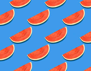 Red watermelon on a blue background. Watermelon pattern. Summer concert. Top view