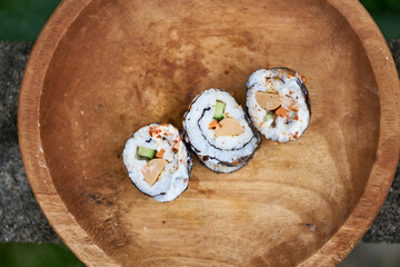 Sushi, a Japanese dish of prepared vinegared rice. Sushi is traditionally made with medium-grain white rice, though it can be prepared with brown rice or short-grain rice.