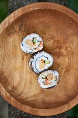 Sushi, a Japanese dish of prepared vinegared rice. Sushi is traditionally made with medium-grain white rice, though it can be prepared with brown rice or short-grain rice.
