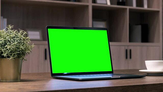 Computer laptop with green screen. Zoom laptop, shopping.