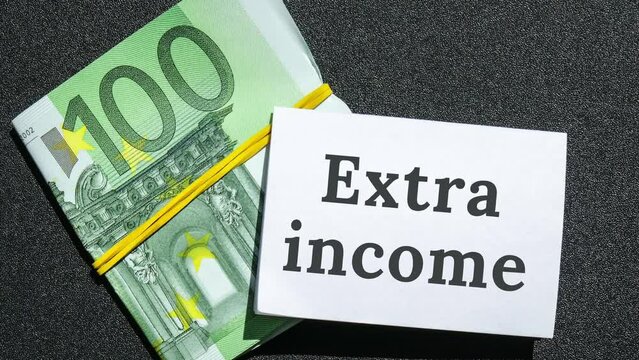 4k zoom in out Euros cash money and paper note with text written EXTRA INCOME. Concept of financial planning. Make more extra money from parttime side hustle or second job. Startup investment