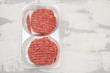 fresh raw minced meat in plastic box