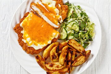 chicken parmo with coleslaw and roast potatoes