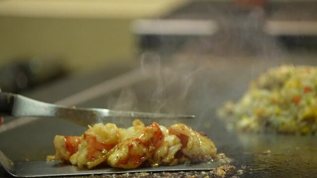 Teppanyaki Restaurants fry prawns served in dish