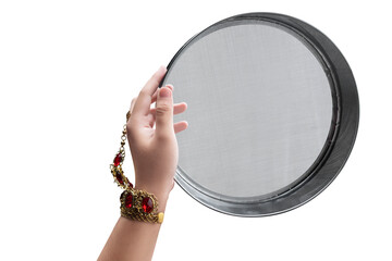 Woman hand holding Karwa Chauth strainer