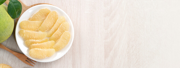 Fresh pomelo fruit on white table background.