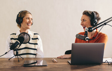 Happy podcasters having a good time in a home studio - obrazy, fototapety, plakaty