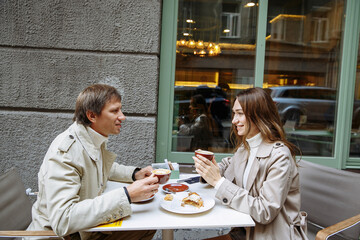 a young couple in love is walking around the city, in an autumn city