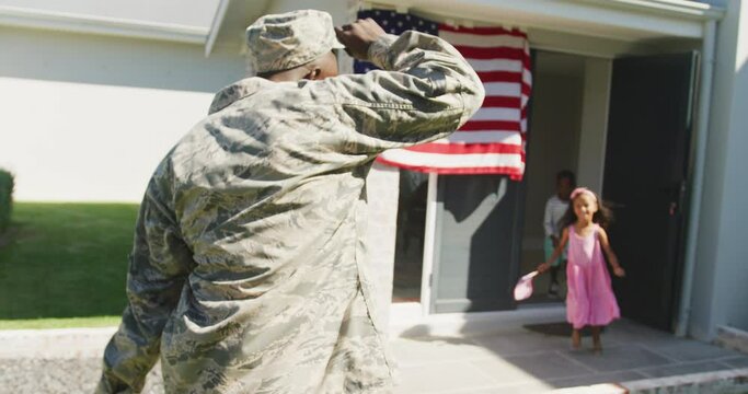 Video of african american soldier father back to his children