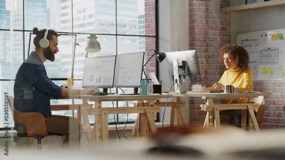 Aufkleber two managers sitting behind desks next to big window with city view and work with marketing campaign