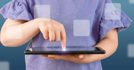 child playing on tablet. finger touching the screen on tablet