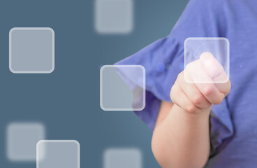 kid's finger pressing button on screen. education online hologram 