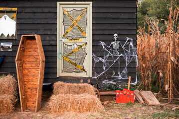 Halloween decoration outside with coffin, skeleton