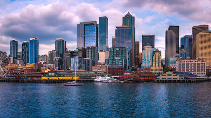 Fototapeta na wymiar Seattle city skyline, dramatic cloudscape over Elliot Bay in Washington State