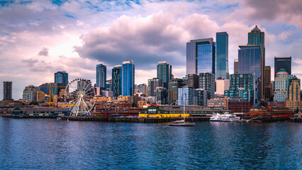 Seattle city skyline with dramatic clouds over Elliot Bay in Washington State, USA © Naya Na