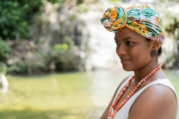 Hispanic Woman with turban in the middle of the river