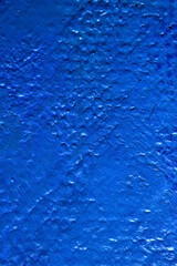 Blue paint on canvas texture close up