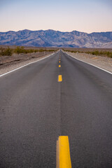 Looking Down A Straight Road Toward The Panamint Range