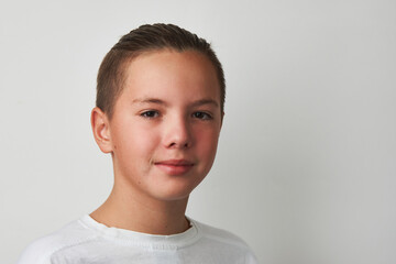 Portrait of a teenage boy on white background