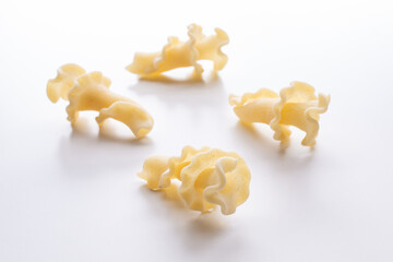 small composition of durum wheat pasta on a white background