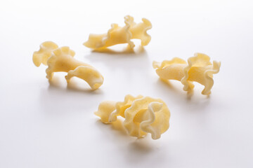 small composition of durum wheat pasta on a white background