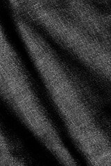 Vertical image of dark denim texture