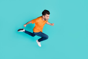 Fototapeta na wymiar Top high angle full length photo of positive man look empty space competition want reach finish first isolated on cyan color background