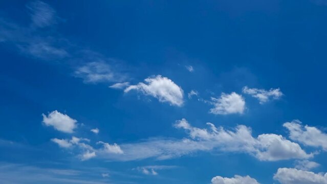 Blue sky white clouds. Puffy fluffy white clouds. Cumulus cloud cloudscape time lapse. Summer blue sky time lapse. Nature weather blue sky. White clouds background. Cloud time lapse , video loop
