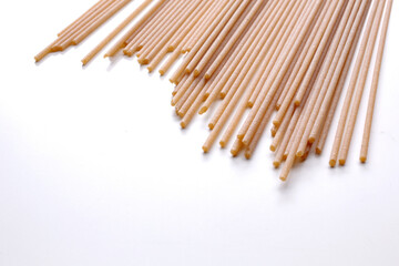 Fototapeta premium whole wheat durum wheat pasta on wooden background