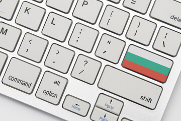 national flag of bulgaria on the keyboard on a grey background .3d illustration - obrazy, fototapety, plakaty