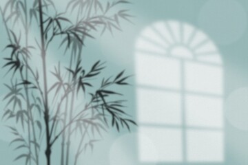 Shadow of bamboo and window on pastel blue wall