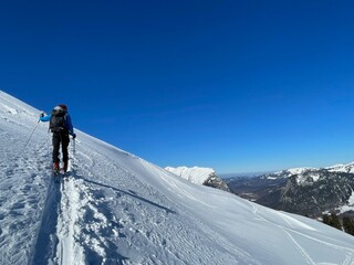 Fototapeta na wymiar Man ski touring in the Austrian Alps. Bregenzerwald, Vorarlberg, Austria.