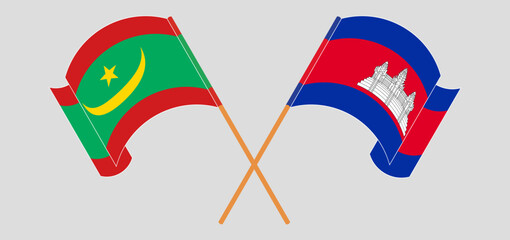 Crossed and waving flags of Mauritania and Cambodia