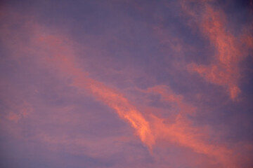 Beautiful gradiant orange clouds and sunlight on the blue sky perfect for the background, take in everning,Twilight, rainy season,winter, summer
