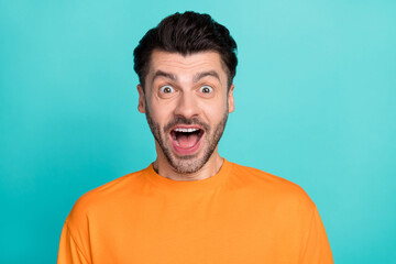 Closeup photo of young handsome impressed funny face guy wear orange t-shirt open mouth excited crazy reaction low prices isolated on cyan color background