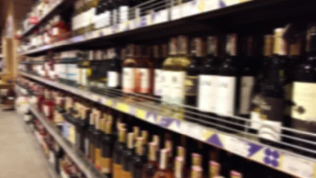 Wine Bottles In The Supermarket. Out Of Focus.