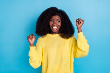 Photo of positive overjoyed lady wear trendy yellow outfit raise arms hands up celebrate shopping...
