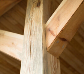 Wooden post with struts.