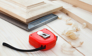 A measuring tape and a square.